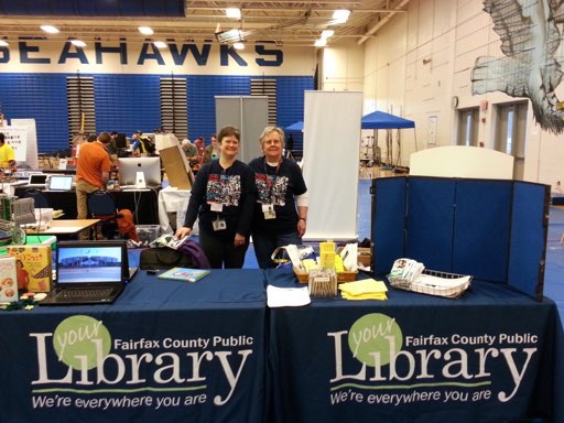 Setting up the Fairfax County Library booth